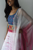  The dupatta is an ombre from pink to white. The blouse is jean material,The skirt is pink and white tie dye and the material is super flowy.