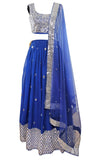Deep blue lehenga covered in stunning mirror work with a matching blouse