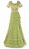 Lime green lehenga paired with a matching skirt with fringe takes it to the next level. Now go get your crown.