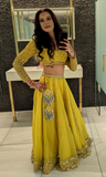 Moss Green/yellow lehenga including skirt, blouse,& dupatta with gold stone work.