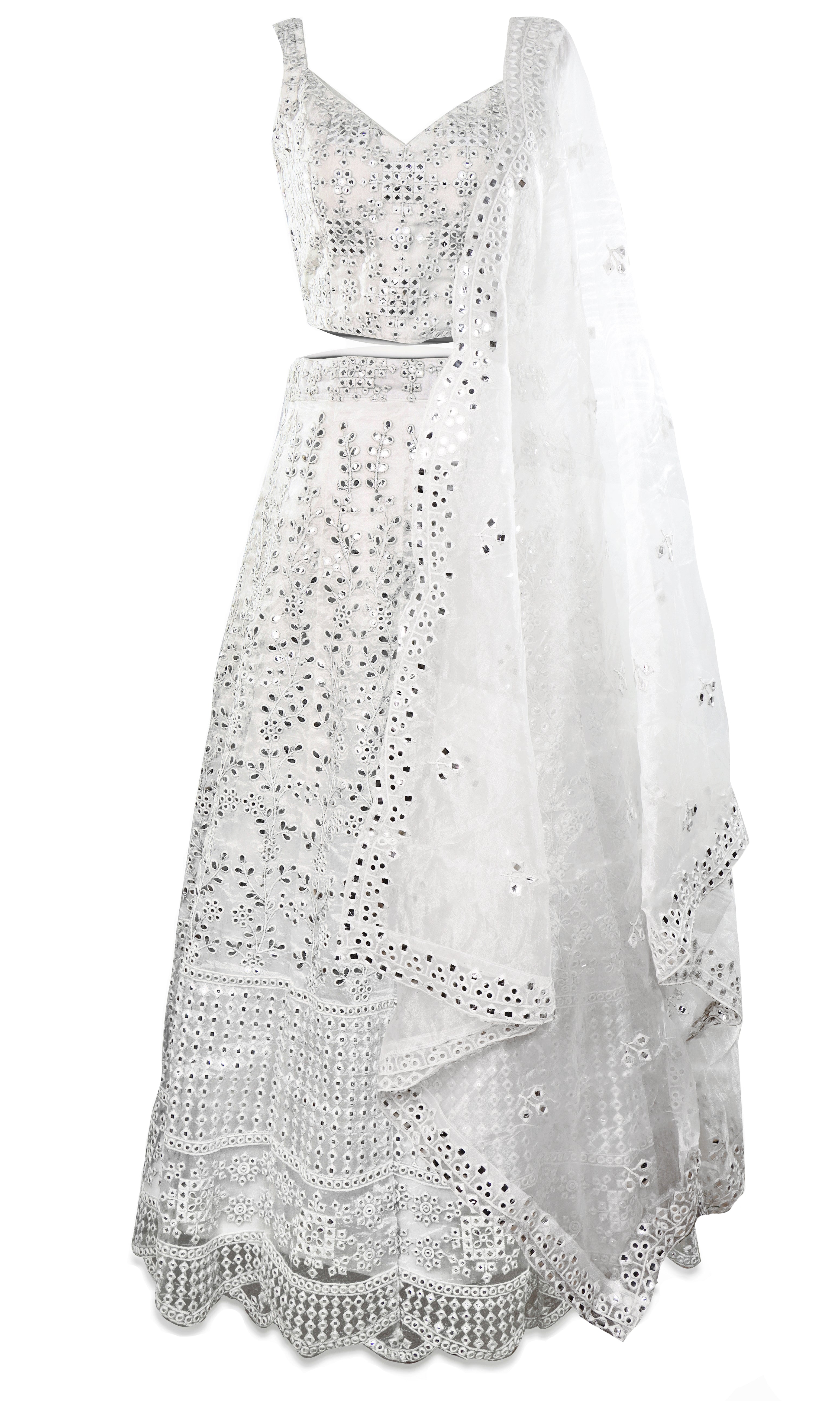 White gorgeous lehenga is all white and decked out with stunning mirror work all throughout.