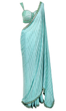 Aqua blue scalloped saree with crepe base & hand embroidery. Paired with a matching sea shell style sequined blouse.