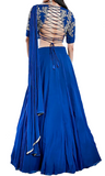 Royal blue lehenga by Divya Kanakia with glass pipes embroidery & paired with a matching blouse & an attached dupatta.