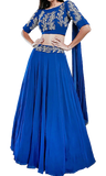 Royal blue lehenga by Divya Kanakia with sequins & glass pipes embroidery. Paired with a matching blouse & an attached dupatta.