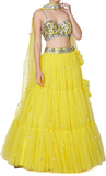 Bright yellow designer lehenga by Preeti S Kapoor, matching blouse & tulle dupatta.