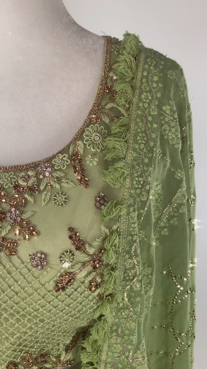 Lime green lehenga paired top, paired with a matching skirt with a gorgeous floral pattern garnished in crystals.
