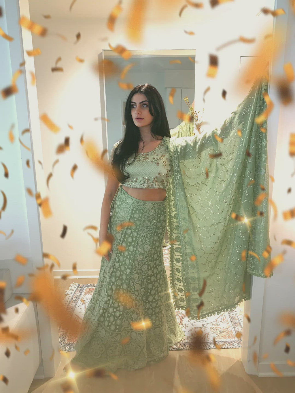 Lime green lehenga paired top is embellished with stunning bronze stones and diamonds