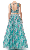 Sky blue multi-color floral lehenga by Izzumi Mehta with sleeveless blouse & bright lime green dupatta
