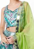 Sky blue floral lehenga by Izzumi Mehta with sleeveless blouse & mirror work bright lime green dupatta