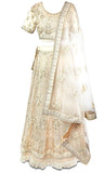 Creme colored lehenga covered in beautiful embroidery in shades of creme, off-white, gold and silver