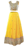 You'll be a walking ray of light in this beautiful bright yellow lehenga mirror work that reflect in the light. 