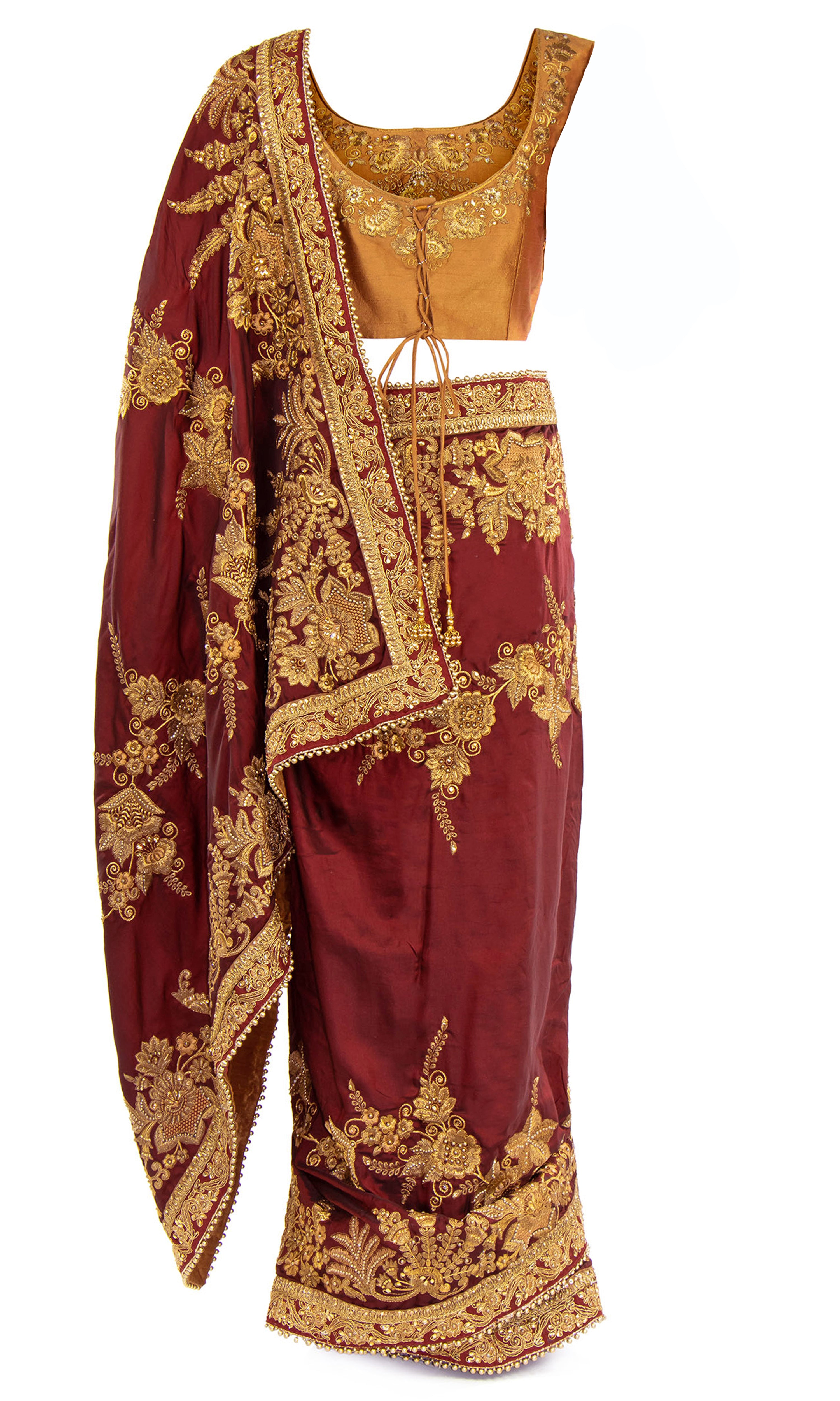Ready-made and pre-pleated maroon silk Saree with burnt orange blouse & Matching petticoat. Embellished with gold thread and beadwork 