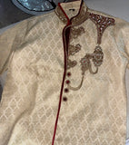 Royal Sherwani in gold color, work on sherwani gold threadwork and crystals. 