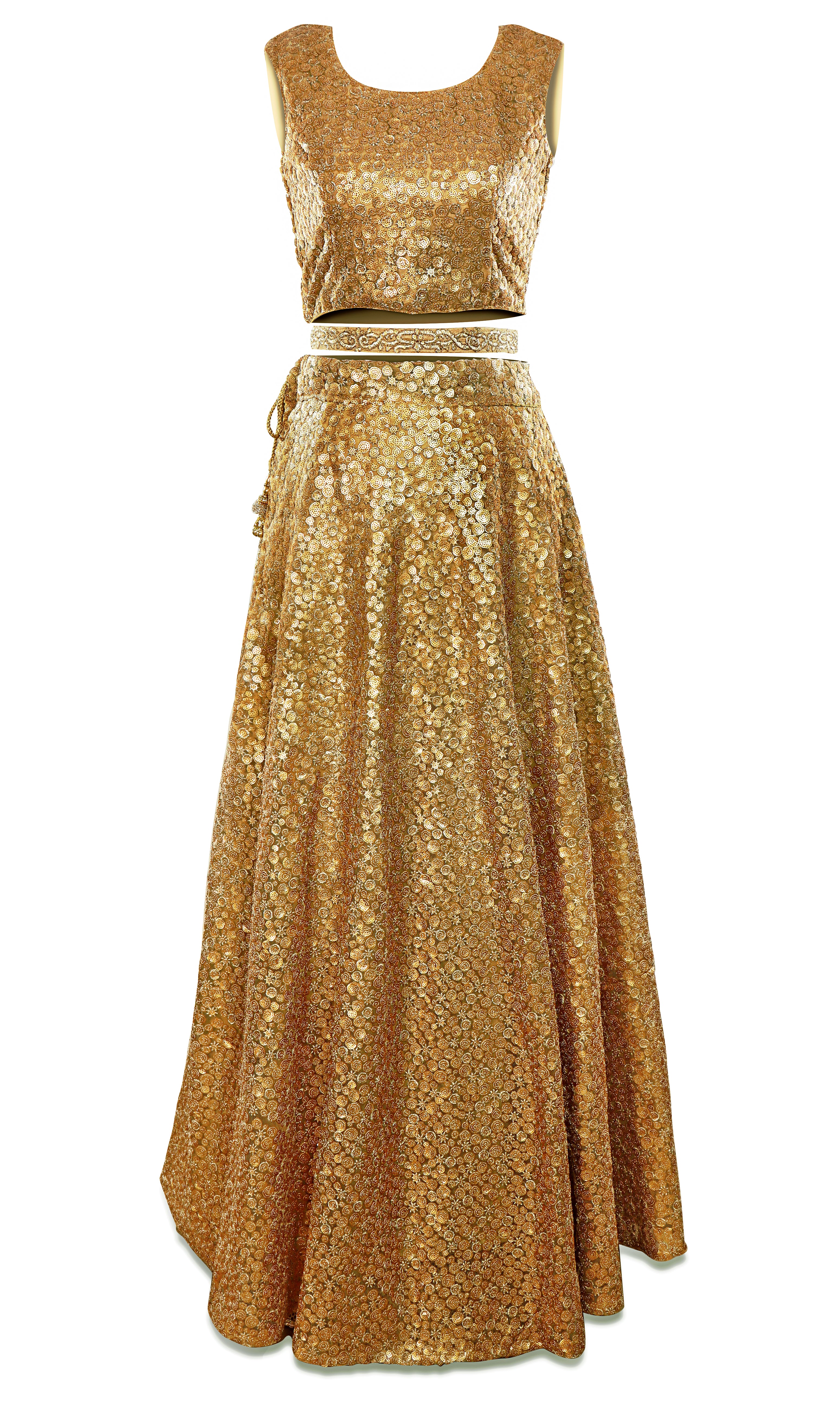 Gold lehenga is covered in glittering gold embroidery and comes with a stunning pale pink dupatta.