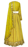 Moss Green/yellow lehenga including skirt, blouse,& dupatta with gold stone work by Vani Vats